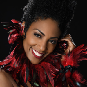 Jazz vocalist Yvette Spears wearing a red boa.