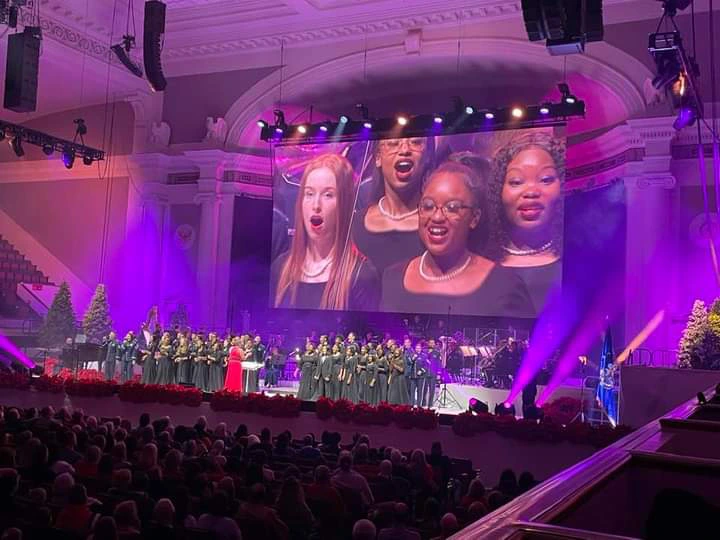 The United States Air Force Band Season of Hope concert photo (2023) featuring the Washington Performing Arts Children of the Gospel Choir on stage at DAR Constitution Hall.